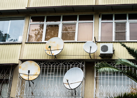 Balconies with satellite dishes and air conditioningの写真素材