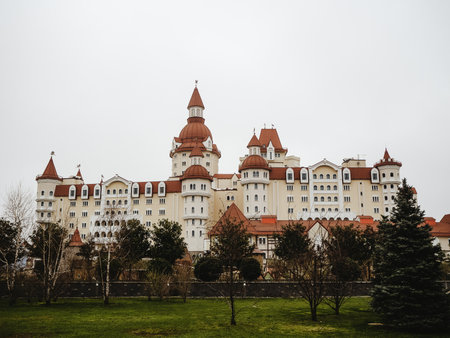 Russia, Sochi 14.03.2020. View of the hotel built in the form of a castle with towers and a red tiled roofのeditorial素材