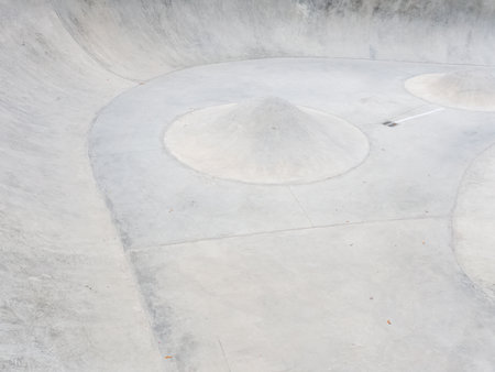Concrete skate park with ramps and cone barriers. Full screen photoの写真素材