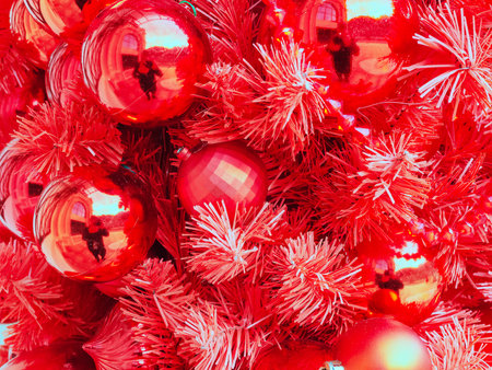 Background texture of red christmas tree and red glossy christmas ballsの写真素材