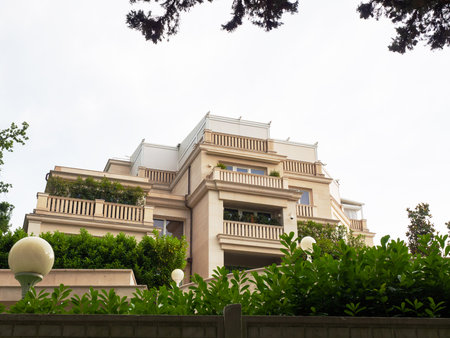Elite private house with verandas and marble fittings surrounded by green plantsの写真素材