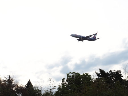 Russia, Sochi 08.05.2021. A large plane descends by releasing its landing gear in the sky over the...