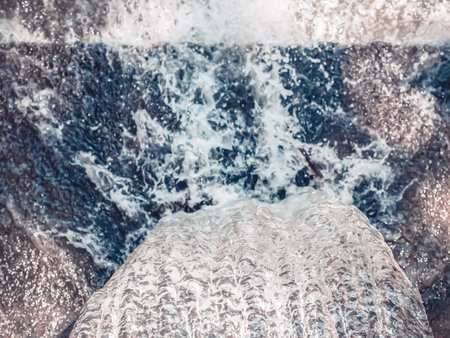 An energetic stream of clear water flowing from top to bottom. Full screen photoの写真素材