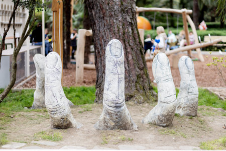 Russia, Sochi Park Riviera 30.04.2022. Sculpture of fingers sticking out of the ground. Selective focus.のeditorial素材