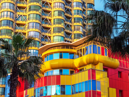 Russia Sochi 16.04.2022. Multi colored high rise building of an unusual design. Unusual southern architecture. Creative building design. The building is in the original style.のeditorial素材