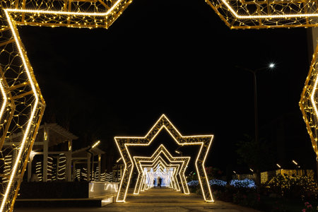 Illuminated star-shaped arches in night scene.の写真素材
