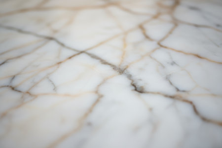 White marble surface with natural brown and gray veins.の素材