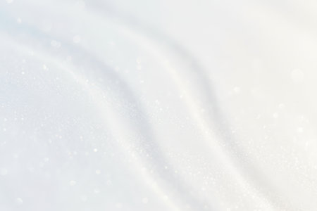 Abstract white and blue background with glitter bokeh.の素材