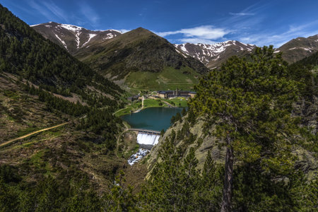 Beautiful landscape of the valley of NÃºria in Spain, the hotel & its dam before the Pyrenees