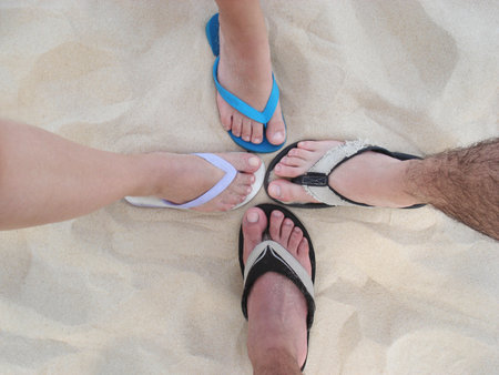 Feet on beach sand