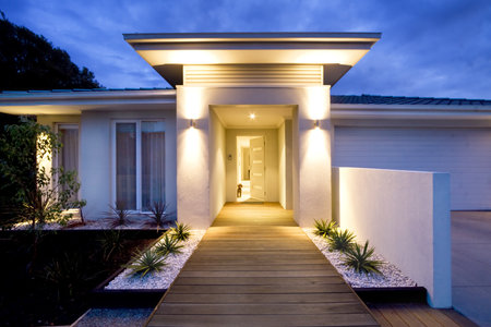 Grand entrance of a contemporary home at duskの写真素材