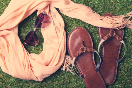 Spring or summer womens fashion accessories lying on grassの写真素材