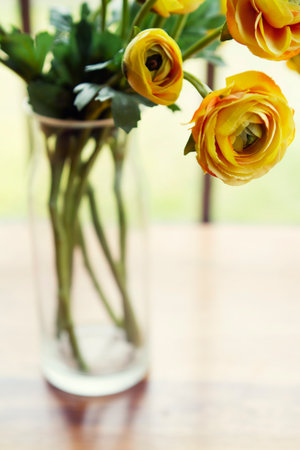 Vase of yellow roses flowers with space for text