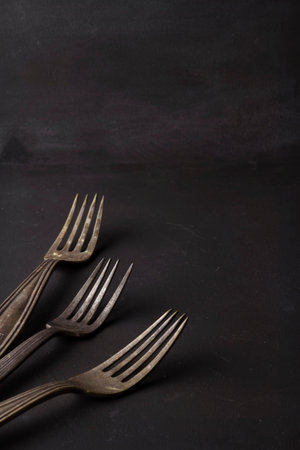 Food black background and vintage forks on chalkboardの写真素材