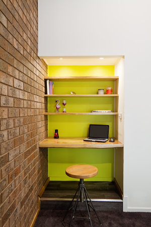 Lime green feature wall study nook in contemporary living roomの写真素材
