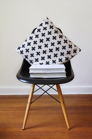 Contemporary black dining chair with modern criss cross cushionの写真素材