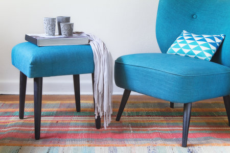 Retro teal armchair and ottoman decor items home interior horizontalの写真素材
