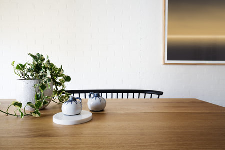 Ivy pot plant on table and white brick wall in dining roomの写真素材