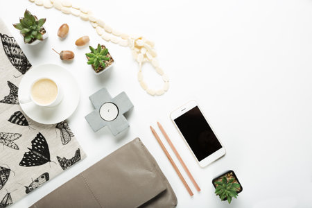 Overhead flat lay collection of desktop fashion and home items with negative spaceの写真素材