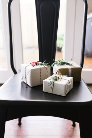 Three pretty Christmas presents in natural wrappingの写真素材