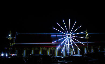 Multi-colored lights circle at the festival.の写真素材