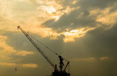 The Crain has under construction under the lighting sky in the evening.