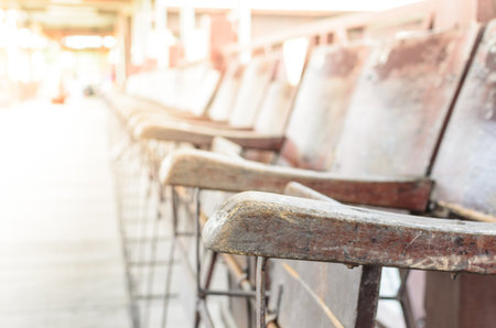 A lot of Wood Chairs in the morning under the lighting.の写真素材