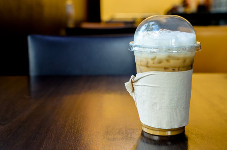 Iced Cappuccino on the wood table in coffee shop restaurant has ready to served.の写真素材