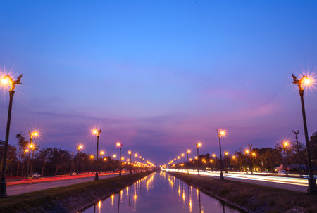Long exposure sunset over a highway Utthayan Road in Bangkok Thailand.