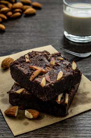 Chocolate Brownie with Almonds on the wood table has ready to served in the dessert time.の写真素材