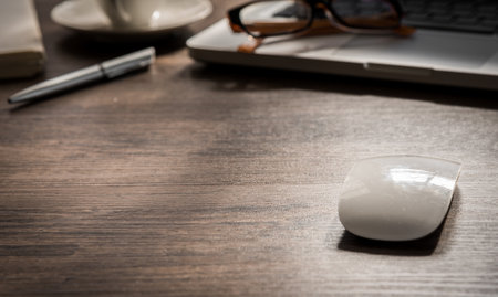 Black coffee on the office desk table with computer, silver pen. Business desk table top view with copy space concept.の写真素材
