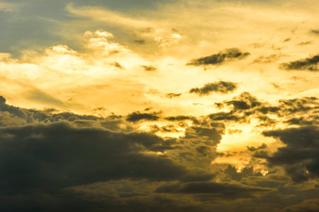 Cloudy sky group with condensation in evening before sunset and raining.