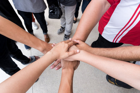 Teamwork with join hands and standing together for cooperation success business,win in every thing.