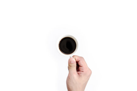 Man has holding for drinking black coffee in the morning. Black coffee cup isolated on white...