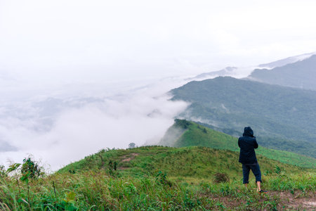 Man photographer taking picture in mountain of Suan Ya Luang, Nan Thailand.の写真素材