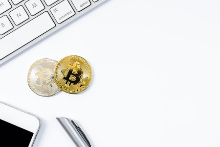 Gold and Silver bit coin with top view flat lay and isolated on white background.の写真素材