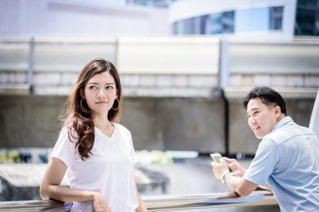 Beautiful asian woman has not care asian man for relationship.の写真素材