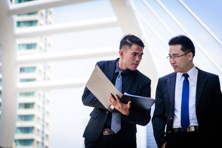 Two asian businessman has talking for business vision.の写真素材