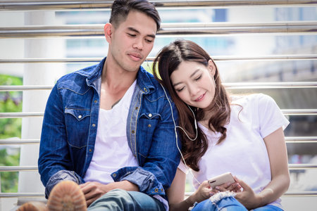 Asian couple tourist have music listening together.の写真素材