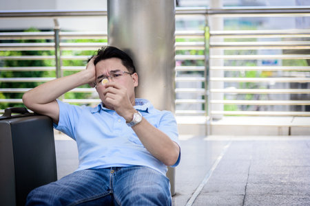 business man sitting in depression with coin money.