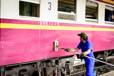 Editorial: Hua Lamphong Station, Bangkok, Thailand, 27th May 2018. Thai man worker has cleaning the train at Hua Lamphong Station in the morning.のeditorial素材