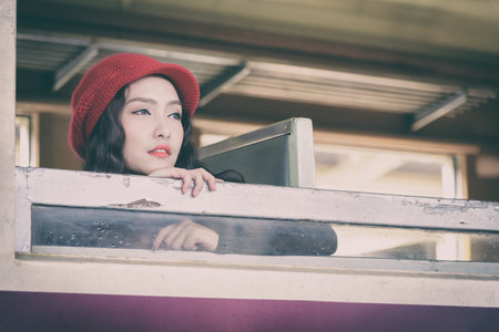 Asian woman traveler has exciting with traveling by train at Hua Lamphong station at Bangkok, Thailand.の写真素材