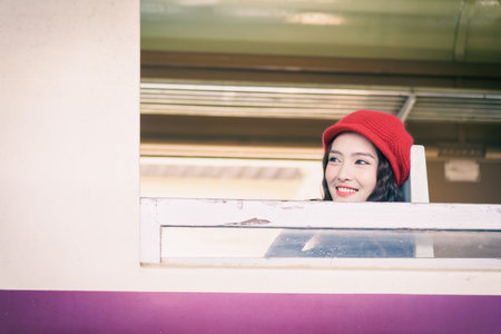 Asian woman traveler has exciting with traveling by train at Hua Lamphong station at Bangkok,...