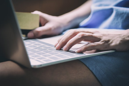 Asian woman traveler has working with laptop and close-up view.