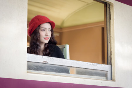 Asian woman traveler has exciting with traveling by train at Hua Lamphong station at Bangkok, Thailand.の写真素材