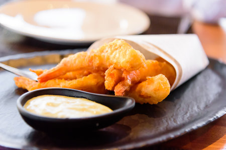 Fried Shrimp with mayonnaise on black plate.の写真素材