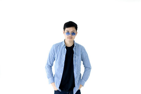 Asian handsome man with blue scott shirt, black shirt and blue eyeglasses isolated on white background.の写真素材