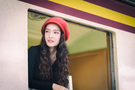 Asian woman traveler has exciting with traveling by train at Hua Lamphong station at Bangkok,...