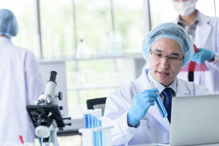 Asian senior scientist male researching and learning in a laboratory.の写真素材