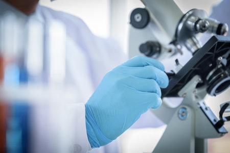 Asian man scientist researching  and learning in a laboratory.